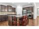 Modern kitchen with granite countertops, stainless steel appliances, and breakfast bar at 3219 Colchester St, Douglasville, GA 30135