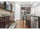 Modern kitchen with stainless steel appliances, granite countertops, and hardwood flooring at 3219 Colchester St, Douglasville, GA 30135