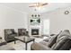 Cozy living room featuring a fireplace, comfortable seating, and natural light at 3219 Colchester St, Douglasville, GA 30135