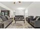 Spacious living room with hardwood floors, ample seating, and natural light at 3219 Colchester St, Douglasville, GA 30135