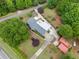 Aerial view of stunning home and backyard with mature trees at 3415 Trickum Rd, Woodstock, GA 30188