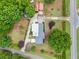 Aerial view of stunning home and backyard with mature trees at 3415 Trickum Rd, Woodstock, GA 30188