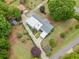 Aerial view of stunning home and backyard with mature trees at 3415 Trickum Rd, Woodstock, GA 30188