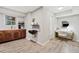 Basement featuring a custom sink, wall art, and a desk in an open, well-lit area at 3415 Trickum Rd, Woodstock, GA 30188