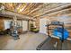 Finished basement featuring wood paneled walls and rubber floor, great for a home gym and recreation space at 3415 Trickum Rd, Woodstock, GA 30188