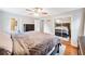 Cozy bedroom with a large bed, dark wood furniture, neutral walls, with an attached bathroom at 3415 Trickum Rd, Woodstock, GA 30188