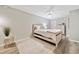 Bedroom with contemporary furnishings, neutral colors, ceiling fan and luxury vinyl flooring at 3415 Trickum Rd, Woodstock, GA 30188