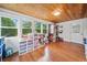 Finished bonus room features wood ceiling, hardwood floors, and ample storage space and natural light at 3415 Trickum Rd, Woodstock, GA 30188