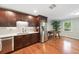 Eat-in kitchen featuring stainless steel appliances, hardwood floors, and an abundance of counter space at 3415 Trickum Rd, Woodstock, GA 30188