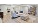 Cozy living room features modern furniture, an ottoman, and a stylish bookshelf at 3415 Trickum Rd, Woodstock, GA 30188