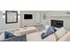 Comfortable living room featuring modern furniture, a fireplace, and a flat screen television at 3415 Trickum Rd, Woodstock, GA 30188