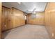 Spacious basement area with wood paneling, carpet, and natural light at 6100 Prestige Valley Rd, Morrow, GA 30260