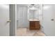 Bathroom featuring a vanity with a sink and storage, tiled floor and closet at 6100 Prestige Valley Rd, Morrow, GA 30260