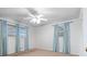Bedroom featuring natural light, ceiling fan, and light blue curtains at 6100 Prestige Valley Rd, Morrow, GA 30260