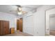 Bedroom featuring closet, adjacent bathroom and ceiling fan at 6100 Prestige Valley Rd, Morrow, GA 30260