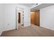 A bedroom with carpet and view to the closet and another room at 6100 Prestige Valley Rd, Morrow, GA 30260