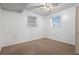 A cozy bedroom with carpet, ceiling fan, closet, and natural light from two windows at 6100 Prestige Valley Rd, Morrow, GA 30260
