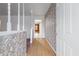 View of the home's entryway with wood floors and decorative wallpaper at 6100 Prestige Valley Rd, Morrow, GA 30260