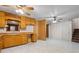 Vintage kitchen with tile floor, wooden cabinets, and updated appliances at 6100 Prestige Valley Rd, Morrow, GA 30260