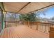 Covered patio with a wooden railing at 6100 Prestige Valley Rd, Morrow, GA 30260