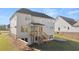 Picture of a rear exterior view of a home with a covered porch and wooden staircase at 739 Marlay Sw Ln, Powder Springs, GA 30127