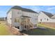Backyard view of home with deck, patio, and landscaped yard at 739 Marlay Sw Ln, Powder Springs, GA 30127