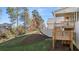 Backyard view of home with deck, patio, and landscaped yard at 739 Marlay Sw Ln, Powder Springs, GA 30127