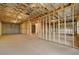 Spacious unfinished basement with concrete floor, exposed ceiling, and wooden frame walls with window at 739 Marlay Sw Ln, Powder Springs, GA 30127