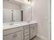 Bright bathroom with double vanity featuring neutral cabinetry, stylish fixtures, and ample counter space at 739 Marlay Sw Ln, Powder Springs, GA 30127