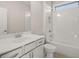 Bathroom featuring white cabinetry, a bathtub-shower combo, and modern fixtures at 739 Marlay Sw Ln, Powder Springs, GA 30127