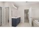Bathroom featuring double vanity, soaking tub and shower with modern finishes at 739 Marlay Sw Ln, Powder Springs, GA 30127