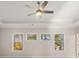 Bright bedroom with a ceiling fan and three windows offering lovely tree views at 739 Marlay Sw Ln, Powder Springs, GA 30127