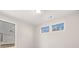 Bedroom featuring two windows and views of the exterior at 739 Marlay Sw Ln, Powder Springs, GA 30127