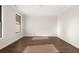 Bright bedroom with dark hardwood floors, white walls and trim, and a window at 739 Marlay Sw Ln, Powder Springs, GA 30127