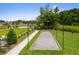An inviting bocce ball court surrounded by lush green grass, perfect for outdoor recreation and community engagement at 739 Marlay Sw Ln, Powder Springs, GA 30127