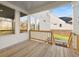 Covered deck with wood railings and view of the backyard and trees at 739 Marlay Sw Ln, Powder Springs, GA 30127