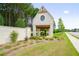 Community entrance showcasing a charming brick structure with a unique round window and timber accents at 739 Marlay Sw Ln, Powder Springs, GA 30127