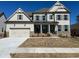 Charming two-story home featuring a two-car garage and beautifully landscaped front yard at 739 Marlay Sw Ln, Powder Springs, GA 30127