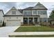 Beautiful two-story home with a two-car garage and well-manicured lawn at 739 Marlay Sw Ln, Powder Springs, GA 30127