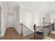 Hallway with hardwood floors, staircase, and modern design for a clean aesthetic at 739 Marlay Sw Ln, Powder Springs, GA 30127