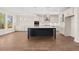 Open-concept kitchen features a large island, stainless appliances, and plenty of cabinet space at 739 Marlay Sw Ln, Powder Springs, GA 30127