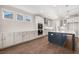 Well-lit kitchen with white cabinetry, stainless steel appliances, and a functional island that includes barstool seating at 739 Marlay Sw Ln, Powder Springs, GA 30127