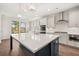 Bright kitchen showcasing a large island with white countertop, stainless steel appliances, and stylish pendant lighting at 739 Marlay Sw Ln, Powder Springs, GA 30127