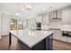 Well-appointed kitchen features a large island, quartz countertops, and modern fixtures at 739 Marlay Sw Ln, Powder Springs, GA 30127