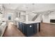 Beautiful kitchen featuring an island with seating and stainless steel appliances that opens up to the living area at 739 Marlay Sw Ln, Powder Springs, GA 30127
