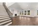 Spacious living room with a fireplace, large windows offering scenic views, and hardwood floors at 739 Marlay Sw Ln, Powder Springs, GA 30127