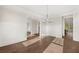 Open living space featuring hardwood floors, wainscoting, and an entry to the kitchen at 739 Marlay Sw Ln, Powder Springs, GA 30127