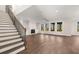 Spacious living room features hardwood floors, fireplace, and lots of natural light at 739 Marlay Sw Ln, Powder Springs, GA 30127