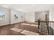 Well-lit upstairs loft space with hardwood floors and access to additional rooms at 739 Marlay Sw Ln, Powder Springs, GA 30127