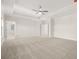 Spacious main bedroom with plush carpeting, tray ceiling, and abundant natural light at 739 Marlay Sw Ln, Powder Springs, GA 30127